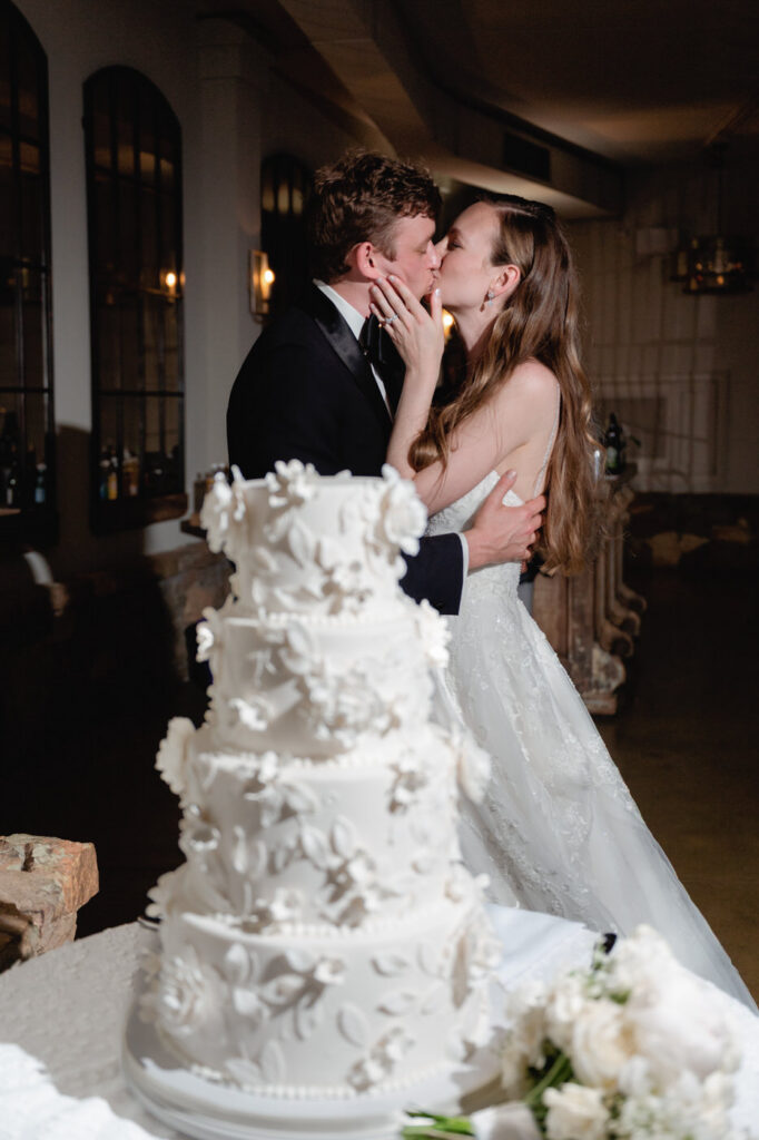 photo of bride and groom kissing